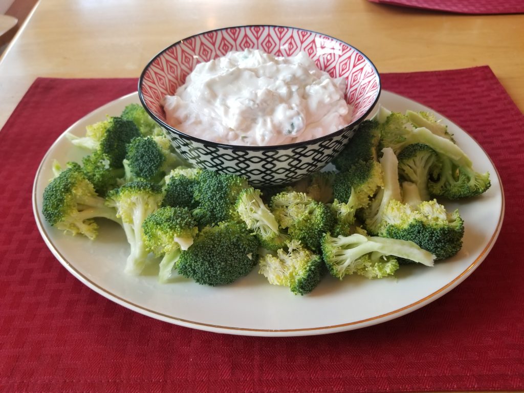 Meriah's Blue Cheese Dip, srurrounded by broccoli. 