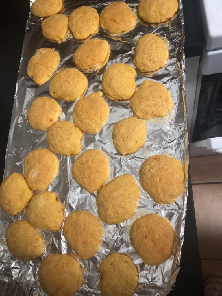 Carrott Cookies cooling on a tin foil covered sheet pan. 