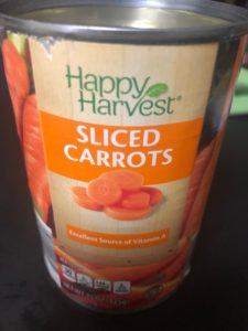 A can of sliced carrots, Happy Harvest brand.